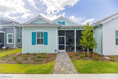 View of front of home with a sunroom, a front yard