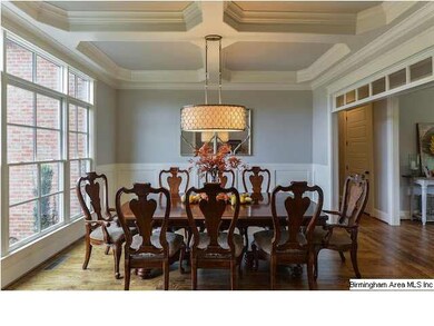 Formal dining room with coffered ceiling, beautifu