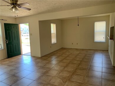 Entryway featuring tile patterned flooring, a text