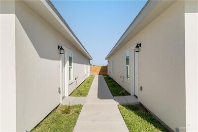 View of home's exterior featuring stucco siding and fence