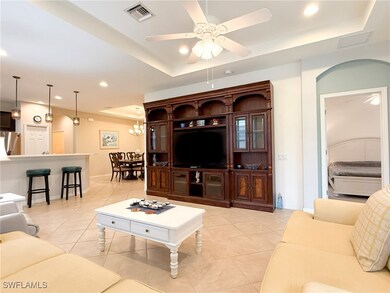 Living room, and entry into the Master bedroom.