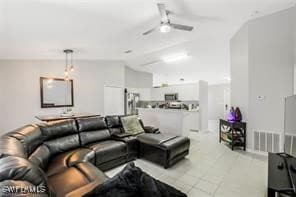 Living room featuring vaulted ceiling and ceiling