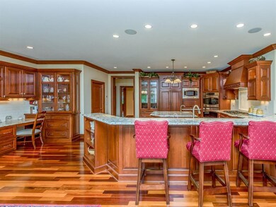Lighted cabinetry, double ovens, and gas cook top 
