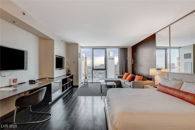 Bedroom with floor to ceiling windows, dark wood-s
