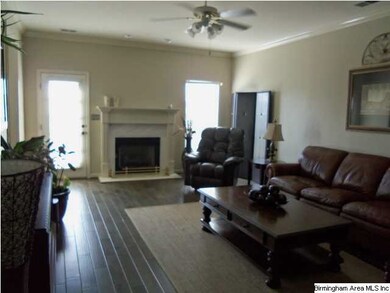 Large Living Room with Hardwood Floors and Marble/