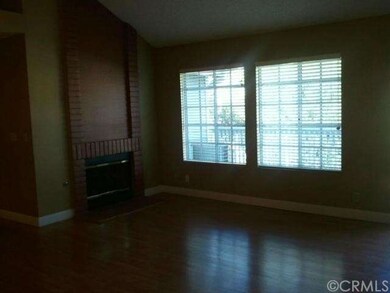 Vaulted ceiling with fireplace in living room.