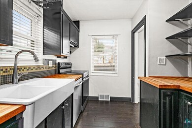 Kitchen with visible vents, butcher block counters