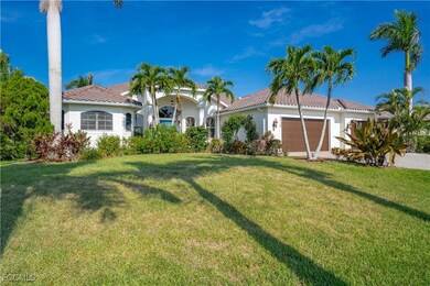 Mediterranean / spanish home featuring a tiled roof, stucco siding, a garage, and a front yard
