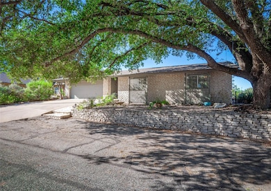 View of front of property with concrete driveway,