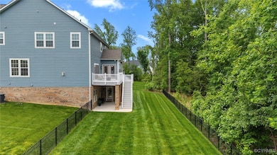 Back of property with Fenced in Back Yard, stairs,