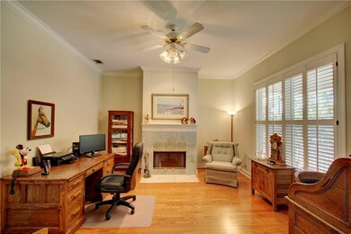 Beautiful fireplace, plantation shutters and hardw