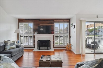 Accent wall with a wood burning fireplace and view of the bayou.