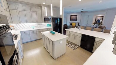 Totally remodeled kitchen looking out into one of 