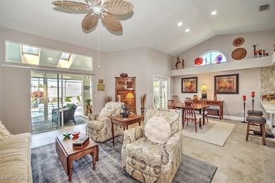 Living area with visible vents, high vaulted ceili