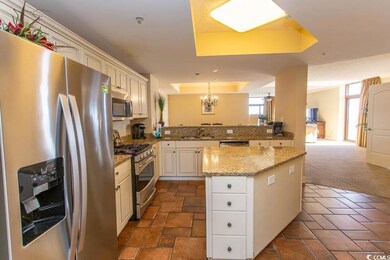 Kitchen with dark carpet, a raised ceiling, sink, 