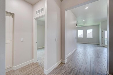 Hall with light colored carpet