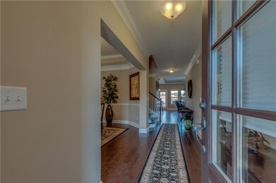 Bright and airy entrance draws you in to the very liveable open floor plan.