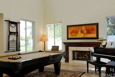 Living Room Fireplace with wood mantle.