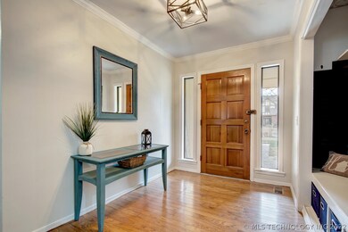 Hardwood floors in entry and hallway.