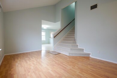 Staircase featuring baseboards, visible vents, wo