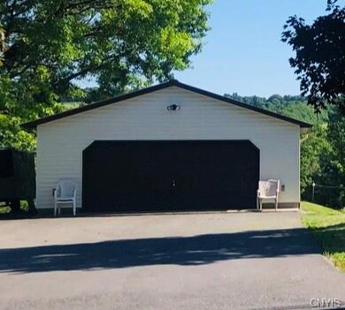 Two car garage with newer metal roof.