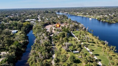 Bird's eye view of water on 3 sides of property