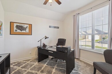 Office featuring ceiling fan and light carpet