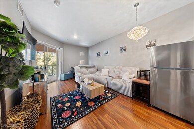Living room with wood finished floors and a notabl