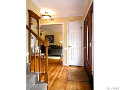 Newer decorative glass front door with sidelights,
