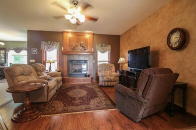 ...beautiful floors and a cozy gas fireplace (1 of