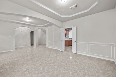 Wainscoting accents the walls of the formal dining