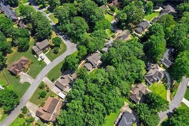 Aerial view of property's location with nearby suburban area