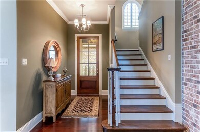 Front door entry leading to open floorplan and sta