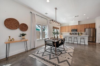 Dining area with baseboards, finished concrete fl