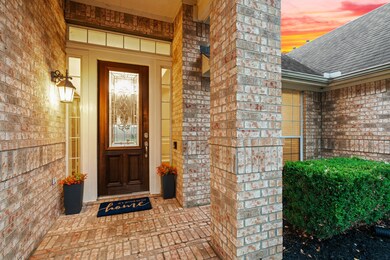Visitors will enter this beautiful home through an impressive covered front porch with handsome coach lighting and an elegant wood and leaded glass door.