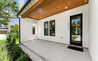 Your covered entryway with a woodpanel ceiling wel