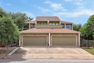 View of front of property with concrete driveway 