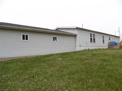 Rear View of house and attached garage.