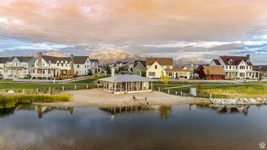 Water view featuring nearby suburban area and mountains