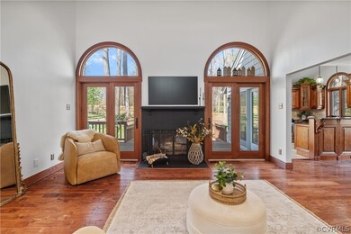 Living room featuring a high ceiling, a notable ch