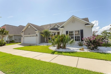 View of front of property with a garage and a fron