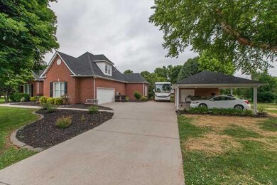 This one has it all! 2 car heated garage plus a 2 car carport with an attached workshop with electricity.