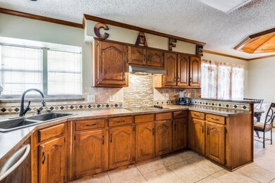 Kitchen featuring sink, stainless steel dishwasher