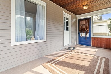 Enclosed porch with newer windows!