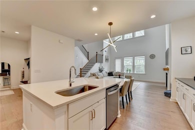 Kitchen featuring stainless steel dishwasher, a si