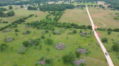Birds eye view of property featuring a rural view