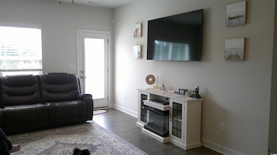 Living room featuring dark hardwood / wood-style f