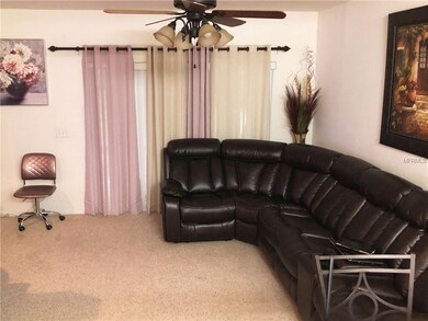 Living room with sliding glass doors to backyard