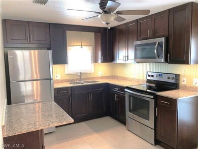 Beautifully remodeled Kitchen features raised-panel wood cabinets, granite counters, and all new stainless steel appliances!
