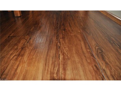 Detail of beautiful hand-scraped hardwood-like Lam